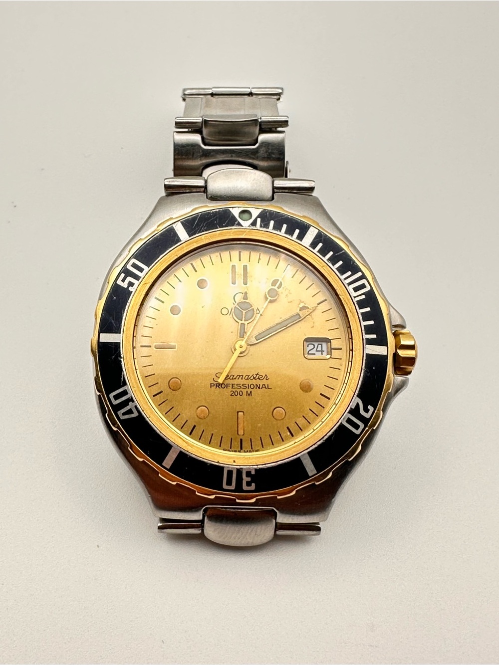 Omega Two-Tone Gold Dial Diver Watch with Black Bezel
